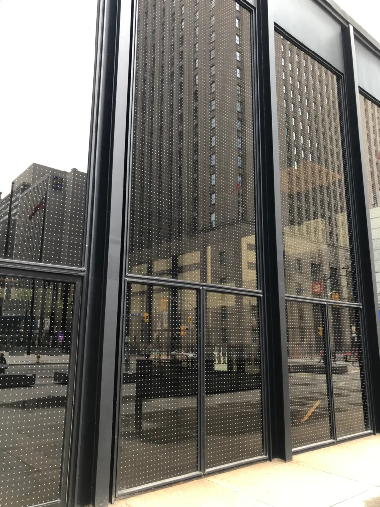 Bird strike prevention window film on commercial glass