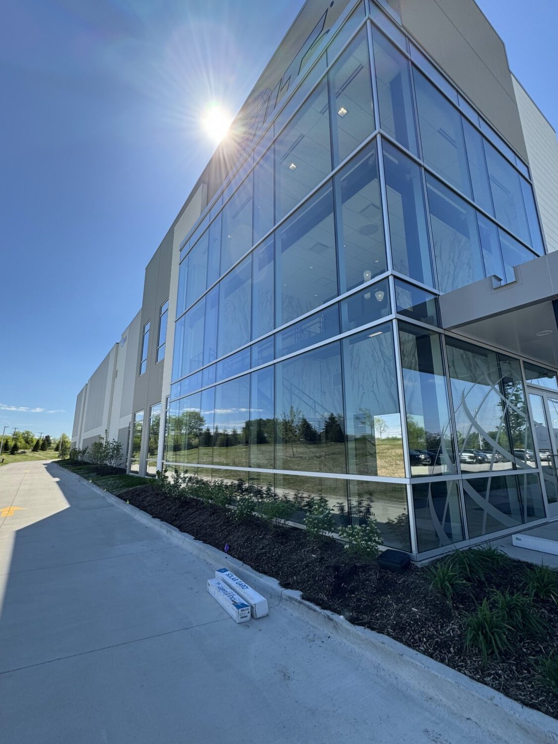 Long glass wall of the AIT Logistics office in direct sun, the heat and glare the window film was installed to reduce.