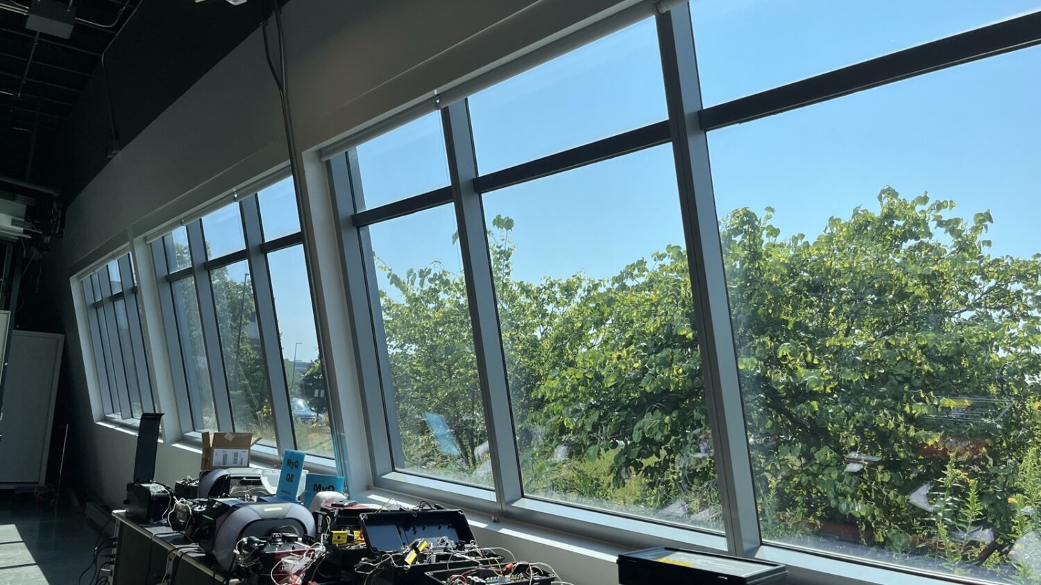 Work lab at Chamberlain Group in Oak Brook with long windows treated with Panorama Slate 30 solar control film by AAA Glass Tint.
